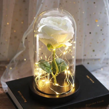 LED simulation rose ornament with glass lampshade on a solid wood base, showing a choice of rose colours.