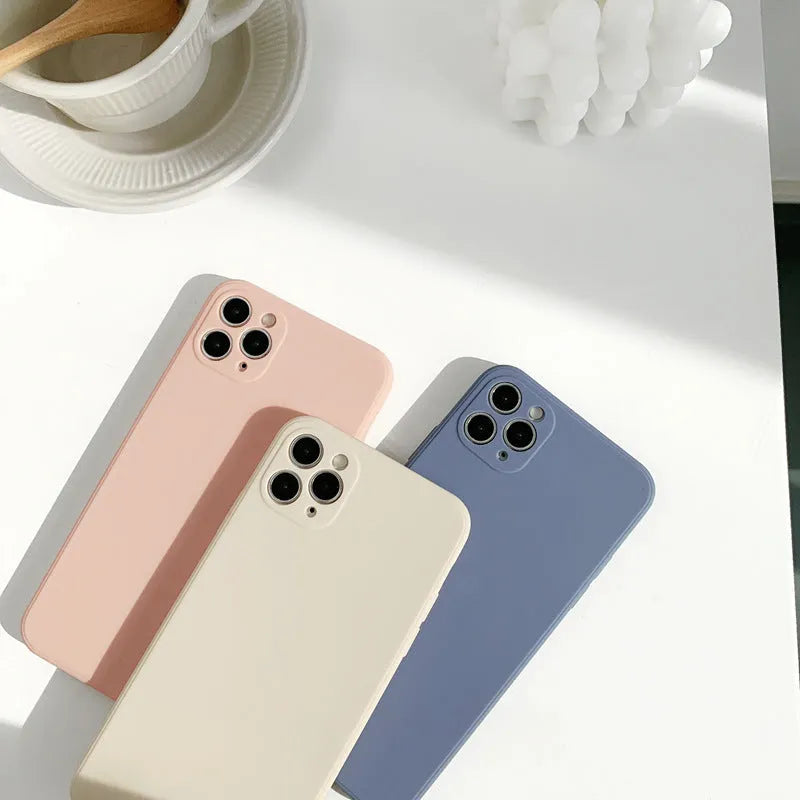 Silicone iPhone case in solid colours, simple painted back cover design available in straight edge powder, slate blue and antique white colourways for iPhone models 7 through 14 Pro Max including iPhone 11, 12 and 14 series