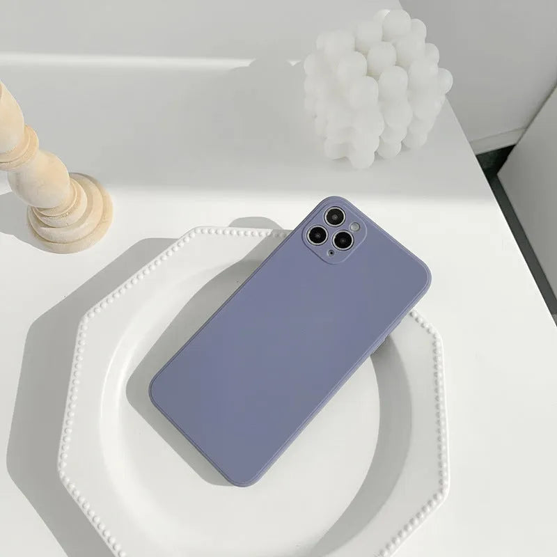 Solid colour silicone iPhone case in straight edge powder, slate blue and antique white options