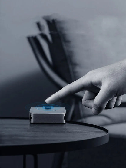 Grey Haibeisi HDMI switcher box with 2 input and 1 output ports for 4K video.