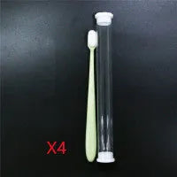 Micron soft toothbrush with coloured handles and different bristle styles including flat head and wavy designs