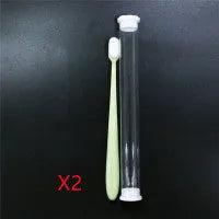 Micron soft toothbrush with coloured handles and different bristle styles including flat head and wavy designs