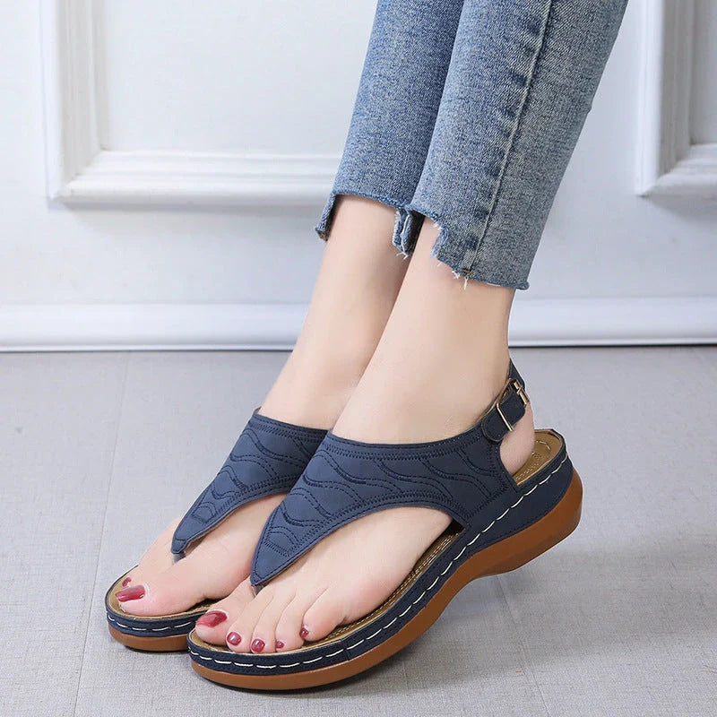 Comfortable women's wedge sandals in various colors with adjustable straps and a lightweight sole