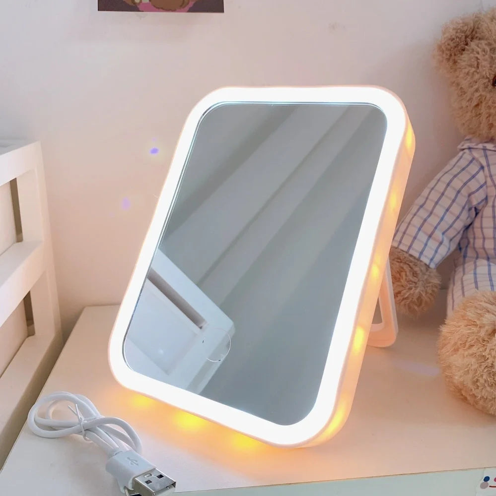 Desktop LED vanity mirror with adjustable folding design in monochrome white colour option