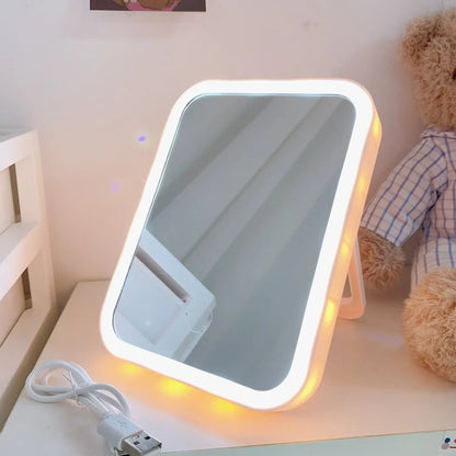 Desktop LED vanity mirror with adjustable folding design in monochrome white colour option
