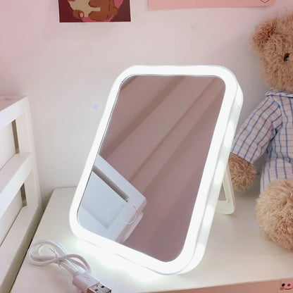 Desktop LED vanity mirror with adjustable folding design in monochrome white colour option