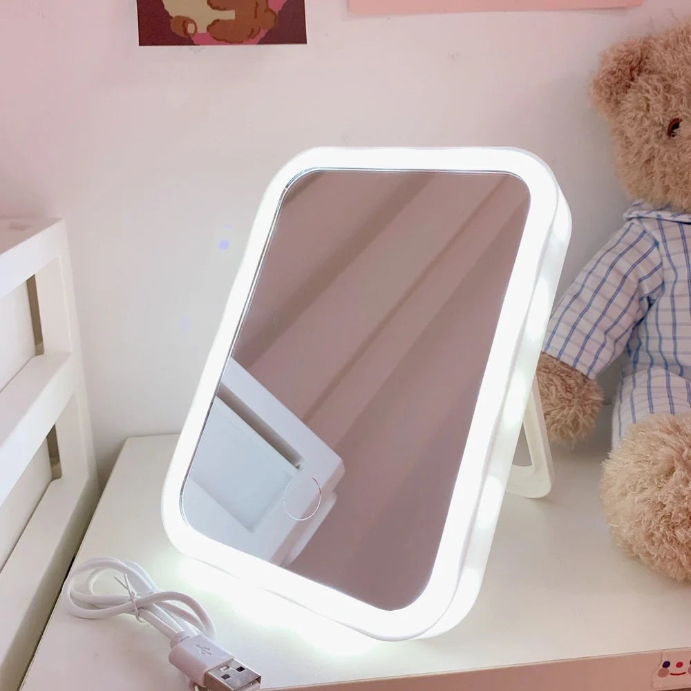 Desktop LED vanity mirror with adjustable folding design in monochrome white colour option