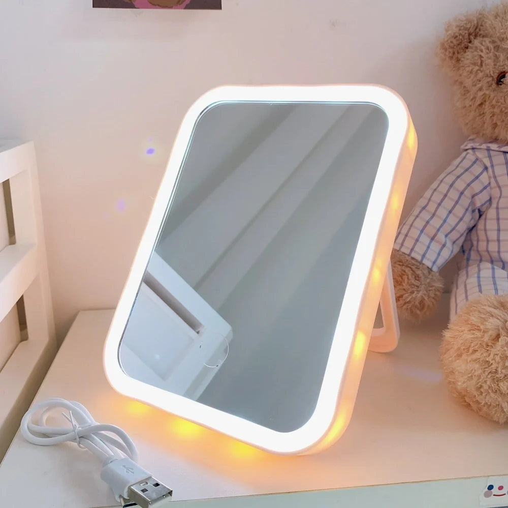 Desktop LED vanity mirror with adjustable folding design in monochrome white colour option