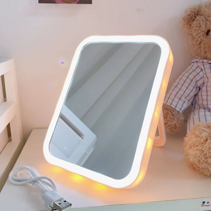 Desktop LED vanity mirror with adjustable folding design in monochrome white colour option