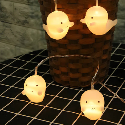 Pumpkin and ghost themed LED lantern with warm white lights in Nordic design style for Halloween decoration
