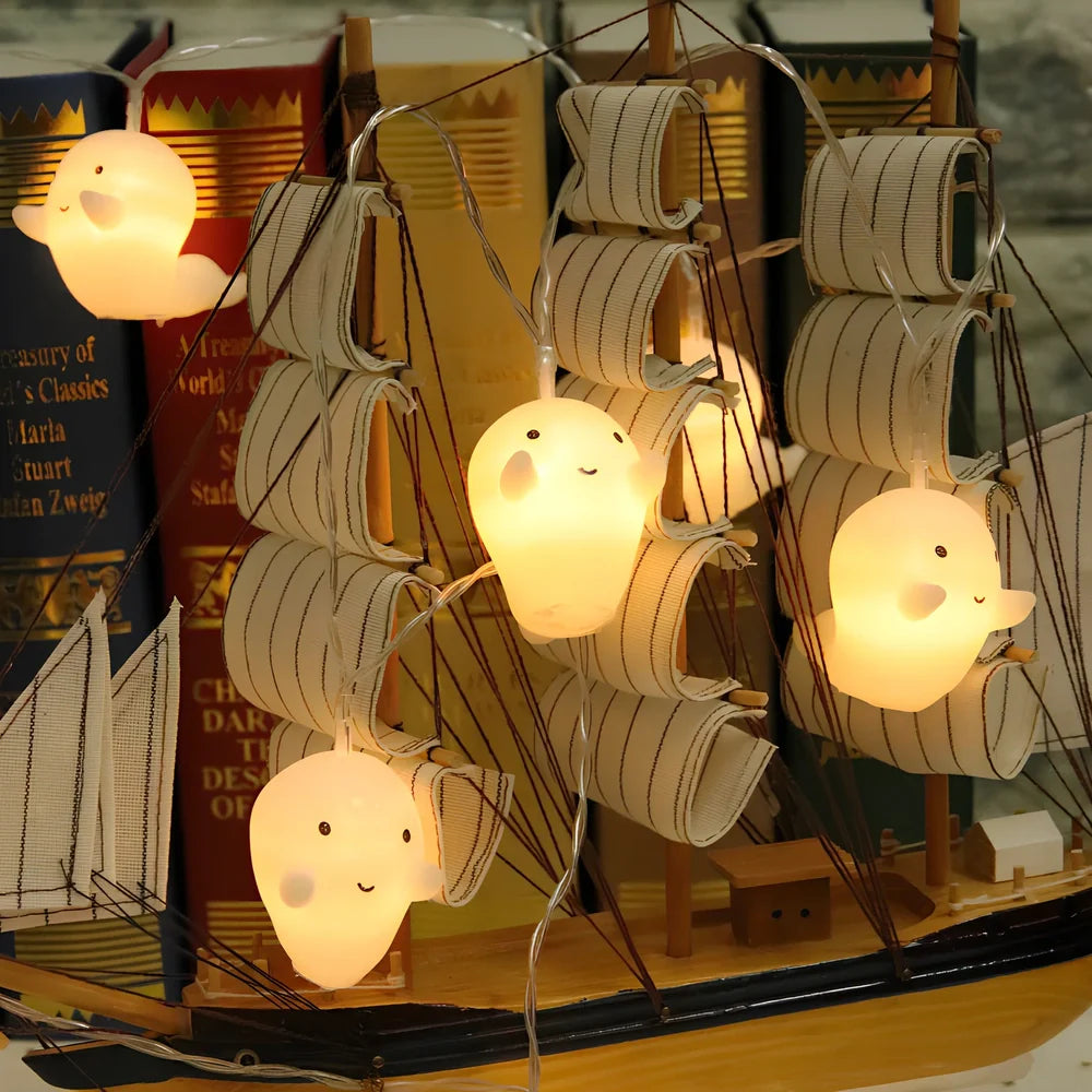 Pumpkin and ghost themed LED lantern with warm white lights in Nordic design style for Halloween decoration