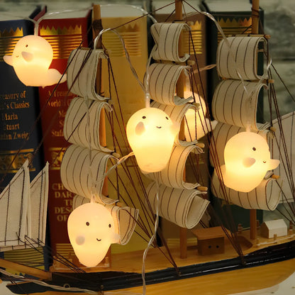 Pumpkin and ghost themed LED lantern with warm white lights in Nordic design style for Halloween decoration