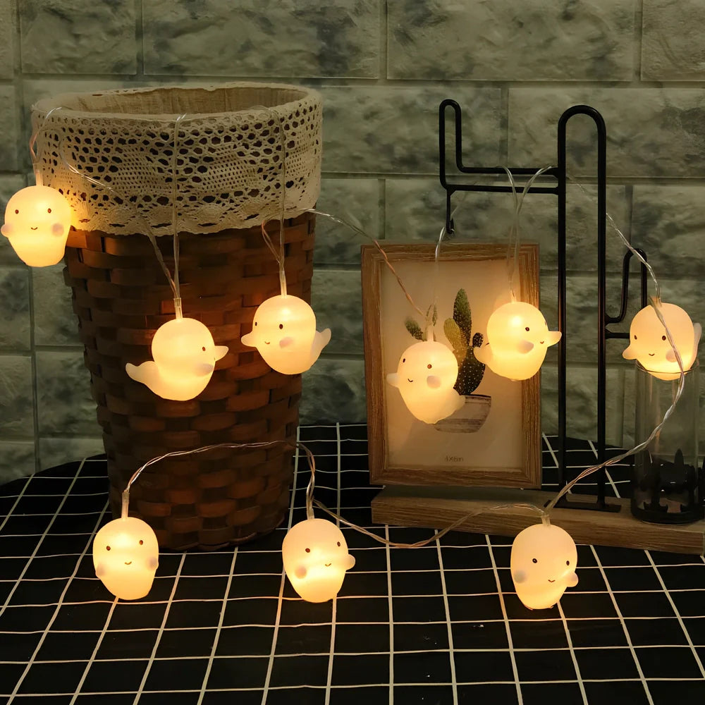 Pumpkin and ghost themed LED lantern with warm white lights in Nordic design style for Halloween decoration
