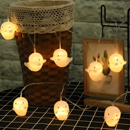 Pumpkin and ghost themed LED lantern with warm white lights in Nordic design style for Halloween decoration