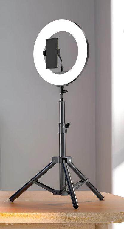 Carbon steel mobile phone tripod extended to full height with a 10-inch lamp attached and phone mounted.