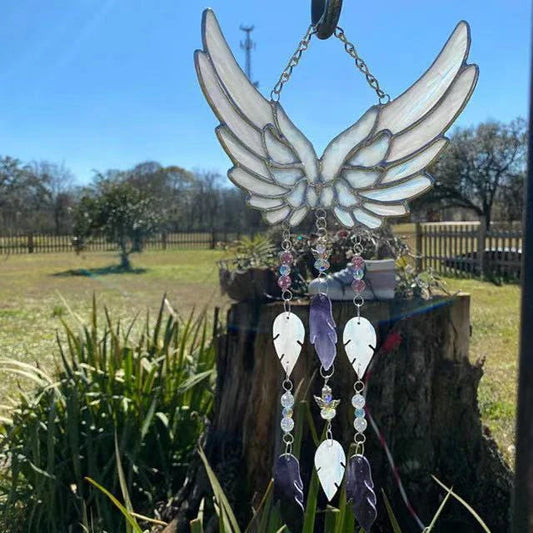 Stunning acrylic and metal angel wing chime suncatcher with sparkling crystal and glass accents, designed to bring a sense of peace and enchantment to your home or garden