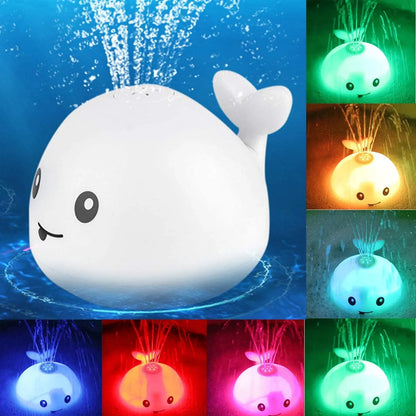 Grey or white electric whale bath toy spraying water with LED lights on a base.