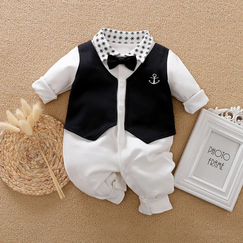 Baby boy in a navy blue long-sleeved cotton jumpsuit with a gentleman-style collar.