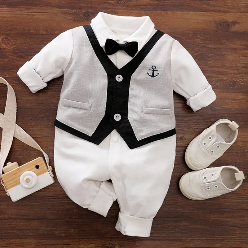 Baby boy in a navy blue long-sleeved cotton jumpsuit with a gentleman-style collar.