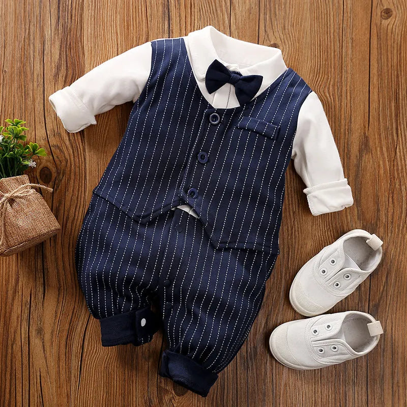 Baby boy in a navy blue long-sleeved cotton jumpsuit with a gentleman-style collar.