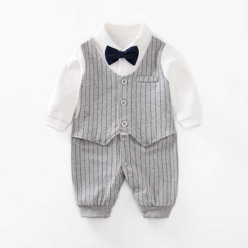 Baby boy in a navy blue long-sleeved cotton jumpsuit with a gentleman-style collar.