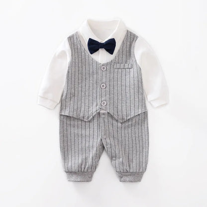Baby boy in a navy blue long-sleeved cotton jumpsuit with a gentleman-style collar.