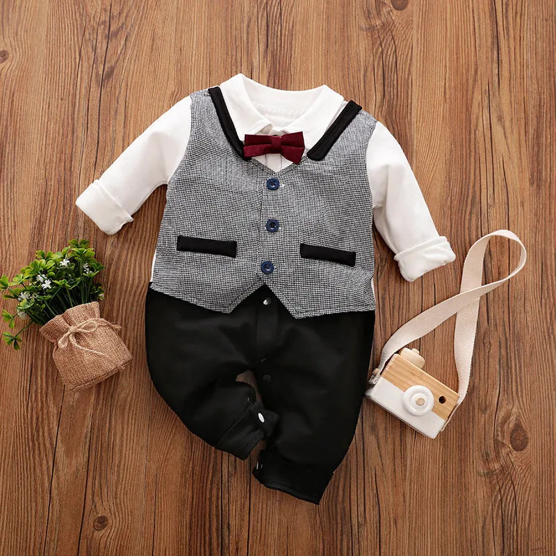 Baby boy in a navy blue long-sleeved cotton jumpsuit with a gentleman-style collar.