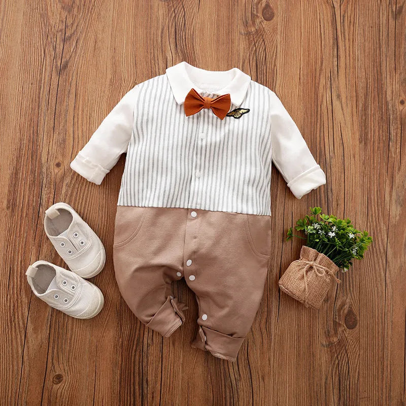 Baby boy in a navy blue long-sleeved cotton jumpsuit with a gentleman-style collar.