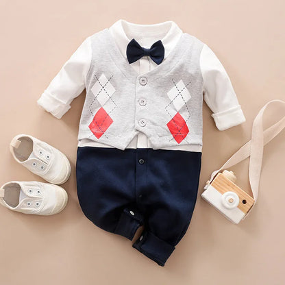 Baby boy in a navy blue long-sleeved cotton jumpsuit with a gentleman-style collar.