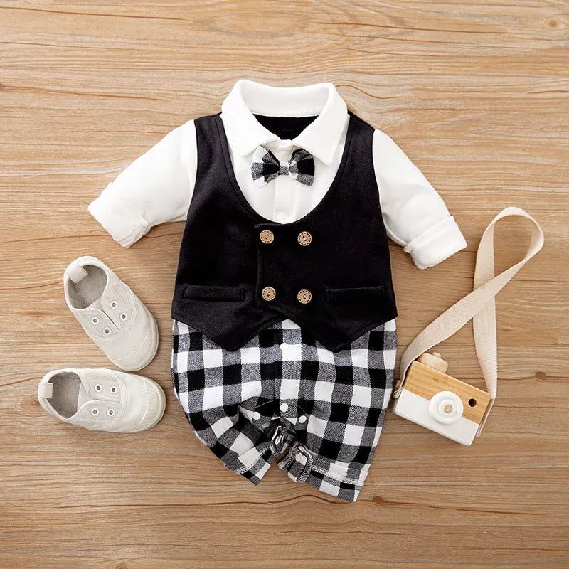 Baby boy in a navy blue long-sleeved cotton jumpsuit with a gentleman-style collar.