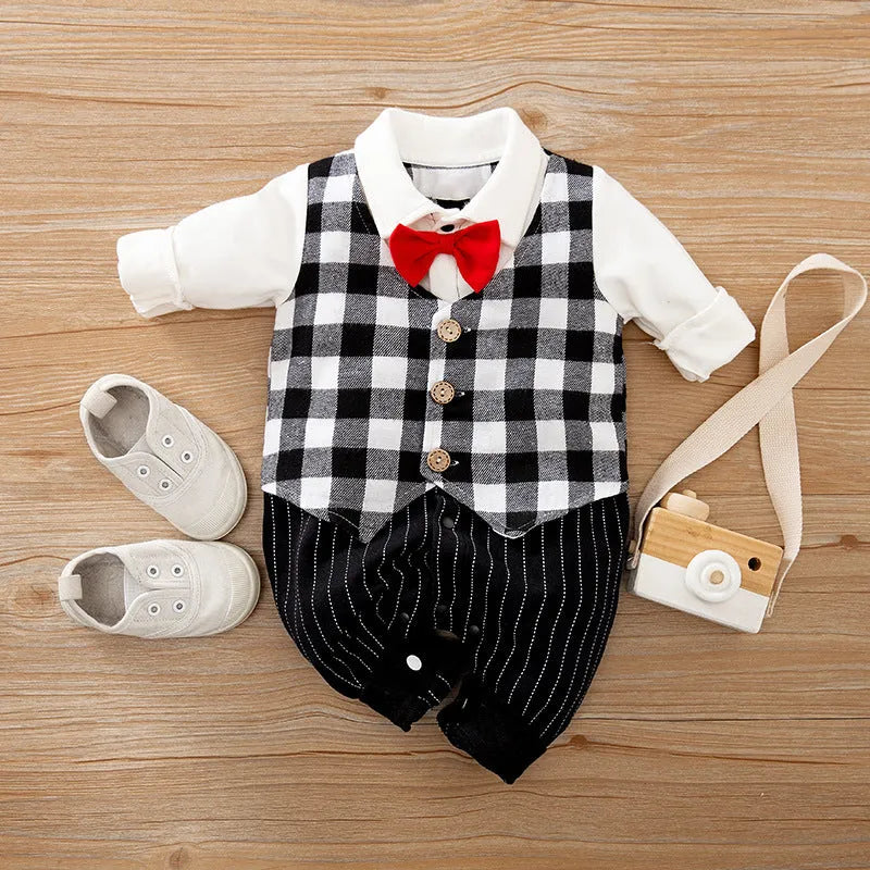 Baby boy in a navy blue long-sleeved cotton jumpsuit with a gentleman-style collar.