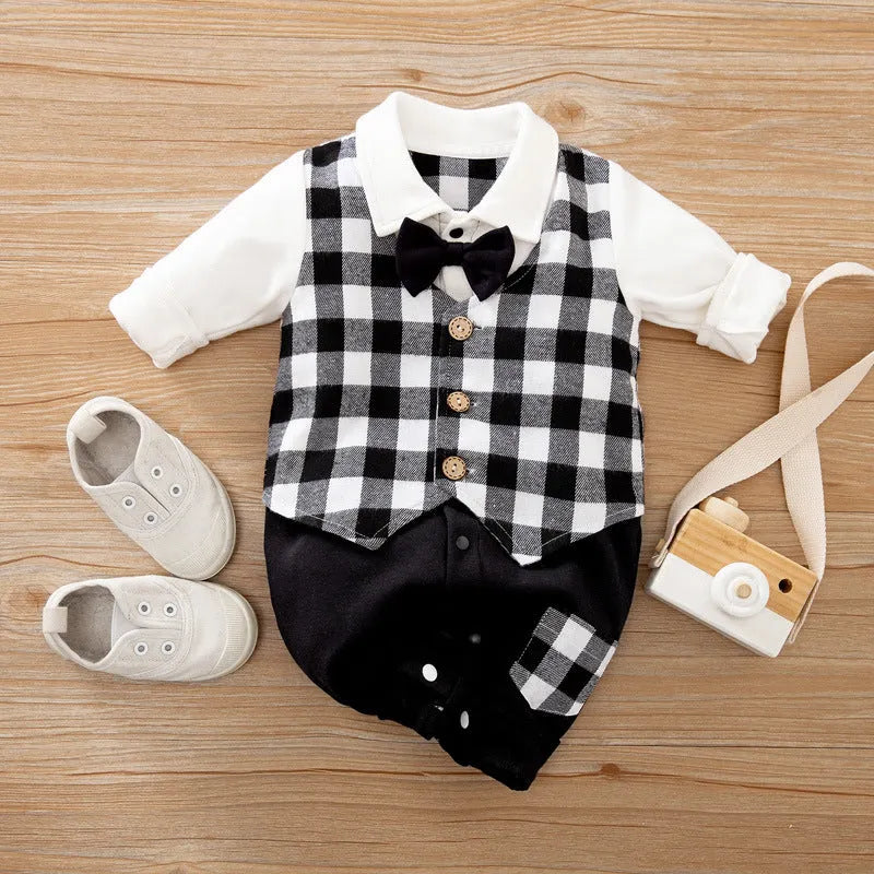 Baby boy in a navy blue long-sleeved cotton jumpsuit with a gentleman-style collar.
