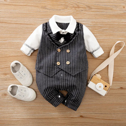 Baby boy in a navy blue long-sleeved cotton jumpsuit with a gentleman-style collar.