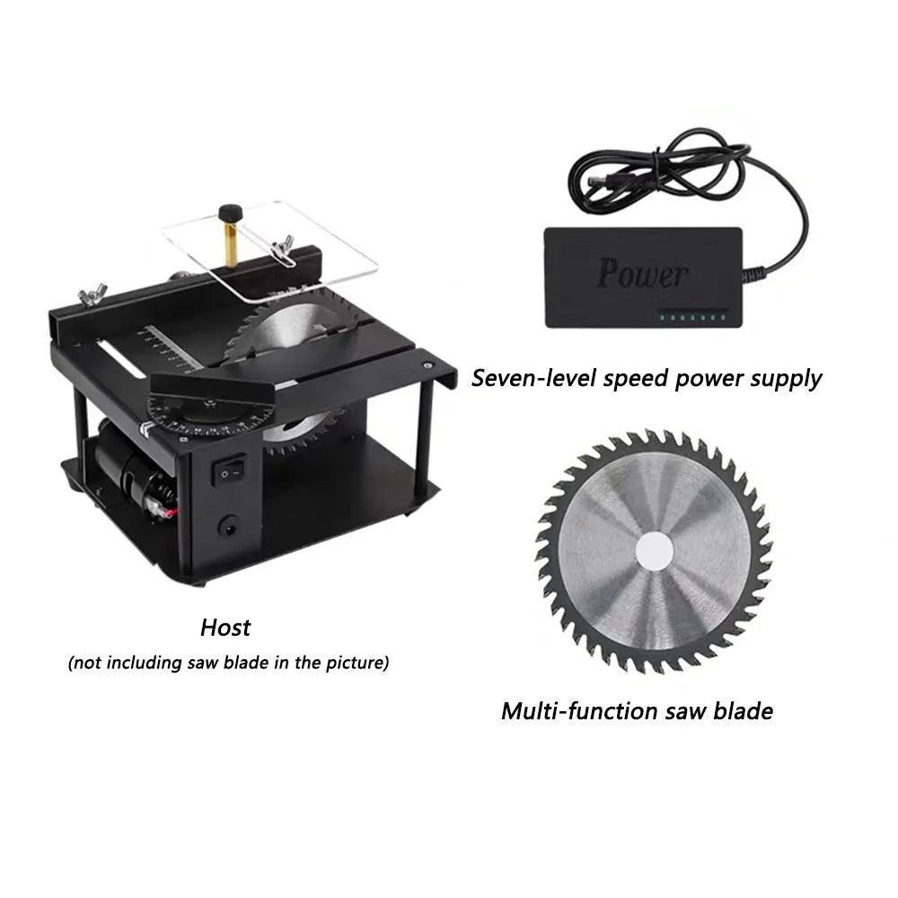 Black miniature precision table saw on a workbench with sliding table and 110mm blade.