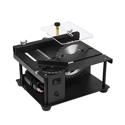 Black miniature precision table saw on a workbench with sliding table and 110mm blade.