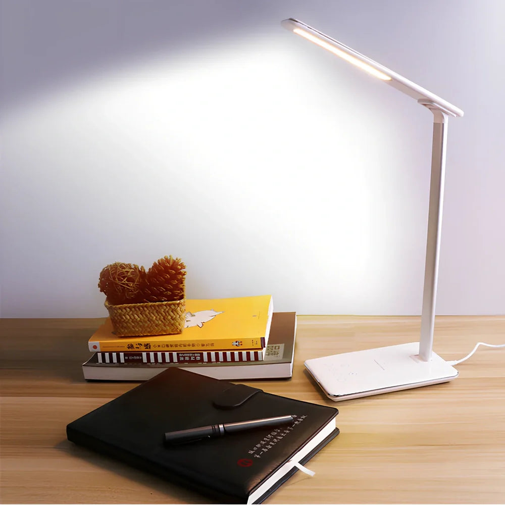 Black folding desk lamp with adjustable arm showing 18cm compact size and touch control panel