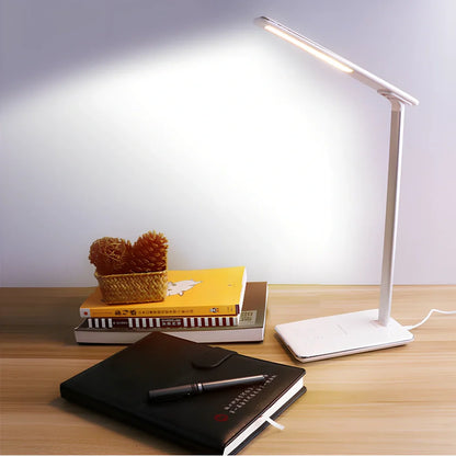 Black folding desk lamp with adjustable arm showing 18cm compact size and touch control panel