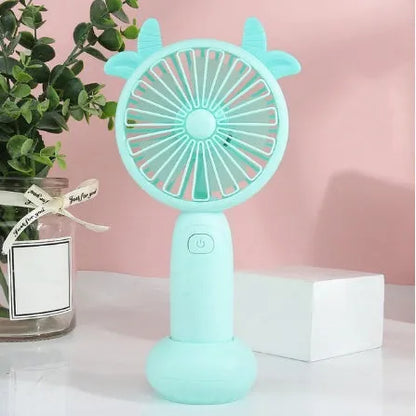 Small handheld cartoon-style USB charging fan in blue, green, pink, or yellow colours.