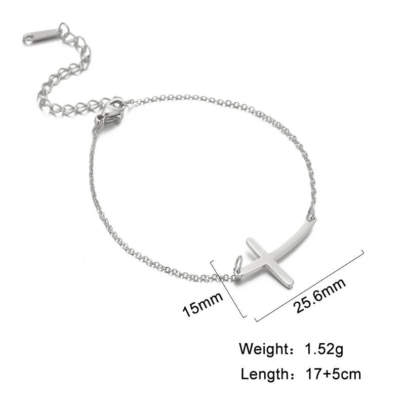 Elegant stainless steel cross pendant bracelet available in steel and gold finishes