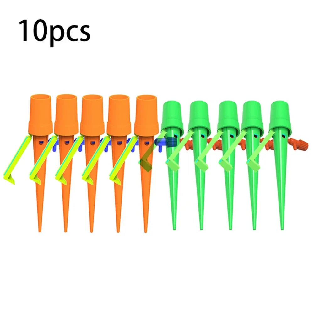 Green and orange plastic garden watering spikes measuring 16.5cm for plant irrigation