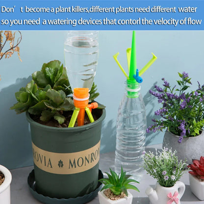 Green and orange plastic garden watering spikes measuring 16.5cm for plant irrigation