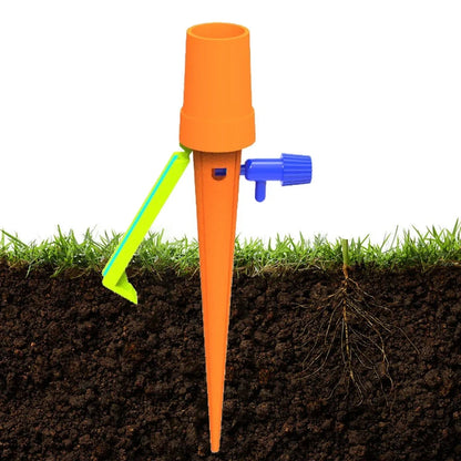 Green and orange plastic garden watering spikes measuring 16.5cm for plant irrigation