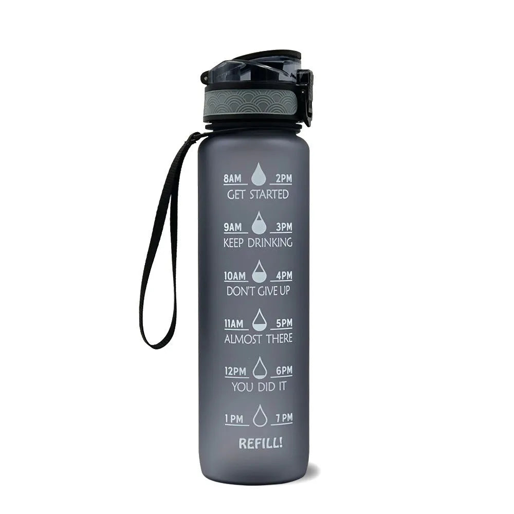 Blue and red gradient 1 litre Tritan sports water bottle with time markers and a flip-top lid.