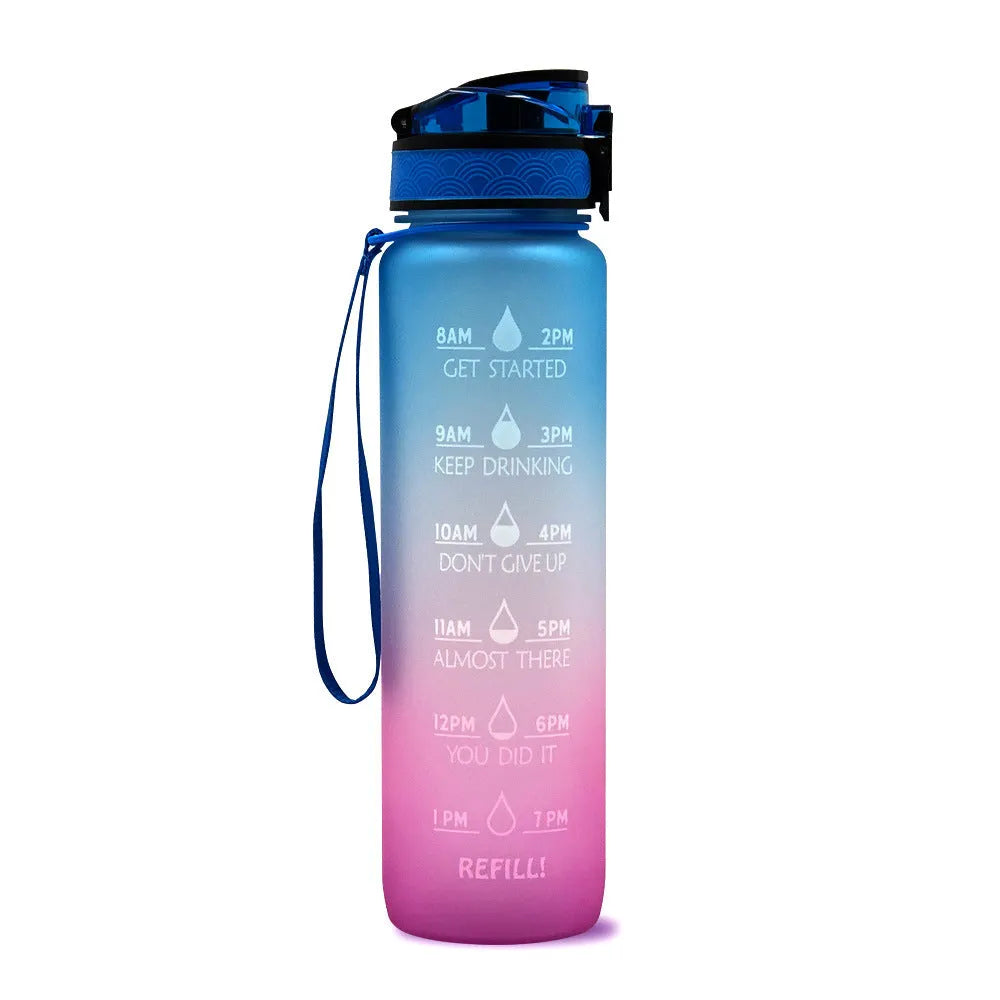 Blue and red gradient 1 litre Tritan sports water bottle with time markers and a flip-top lid.