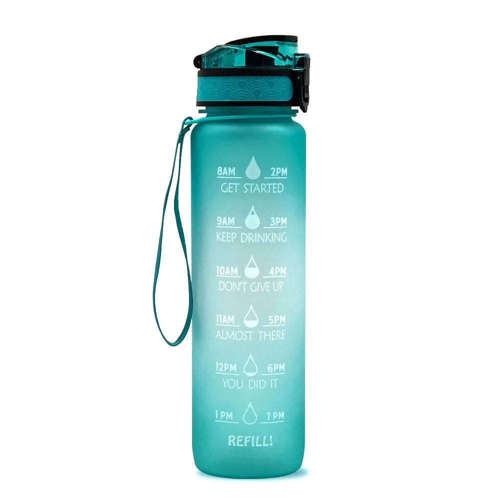 Blue and red gradient 1 litre Tritan sports water bottle with time markers and a flip-top lid.
