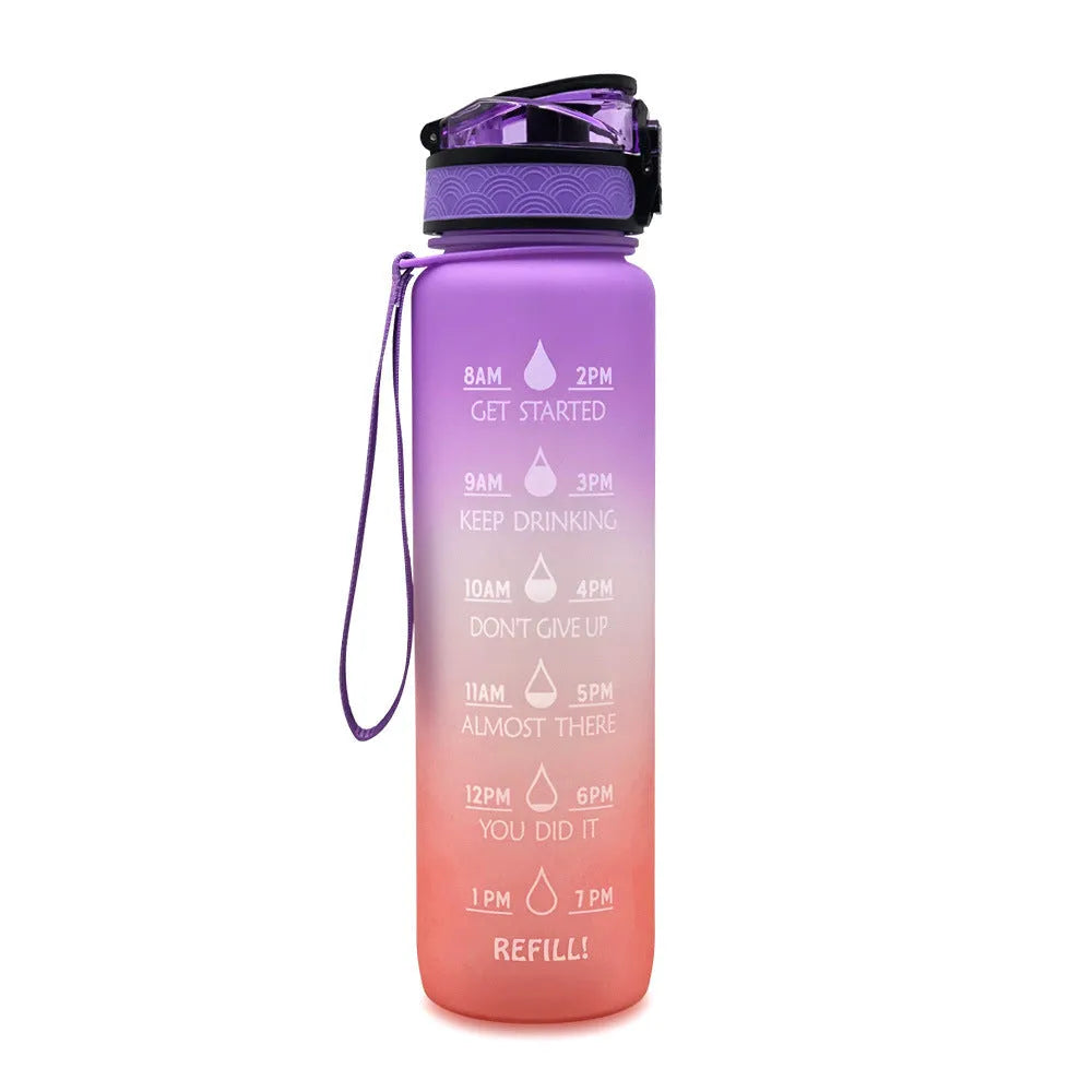 Blue and red gradient 1 litre Tritan sports water bottle with time markers and a flip-top lid.