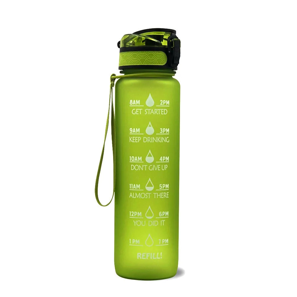 Blue and red gradient 1 litre Tritan sports water bottle with time markers and a flip-top lid.