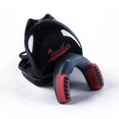Double-sided silicone mouth guard for basketball and boxing, available in multiple colors and sizes.