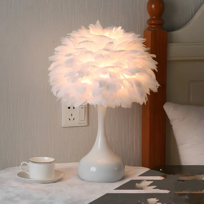 Feather table lamp with hand-woven fur shade and iron base showing adjustable lighting controls