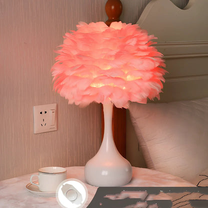 Feather table lamp with hand-woven fur shade and iron base showing adjustable lighting controls